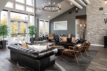 a living room filled with furniture and a large window