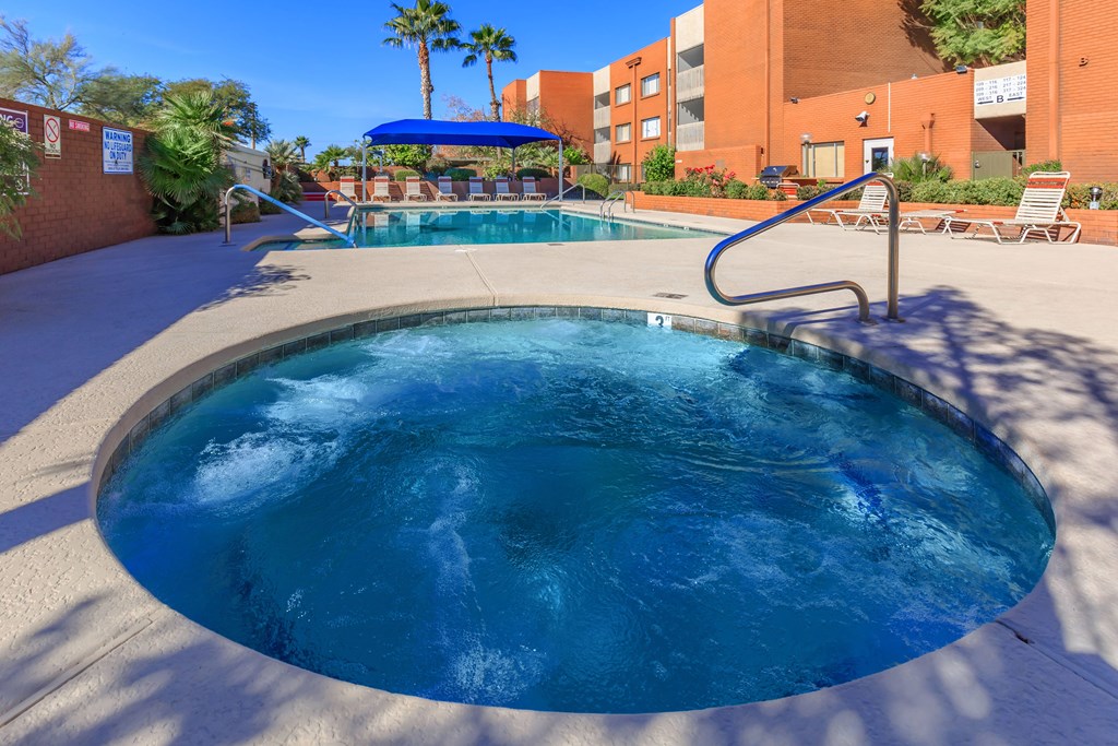 A blue pool with a ladder in the middle of it.