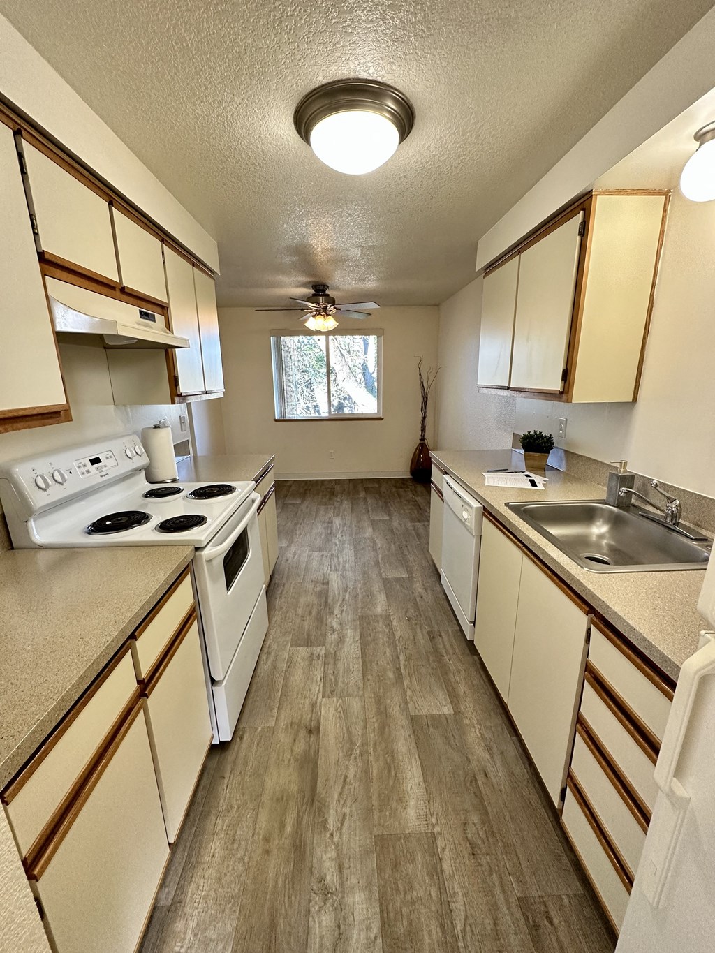 Forest Ridge Apartments Kitchen with white cabinets and appliances