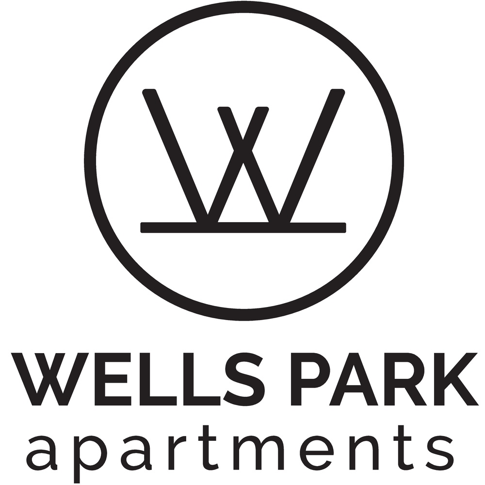 A black and white image of a logo for Wells Park Apartments.