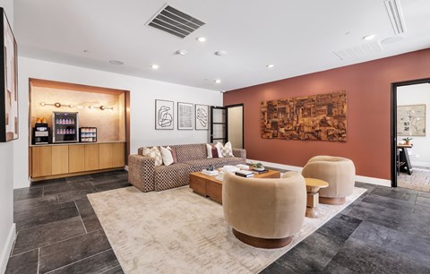 A living room with a brown sofa and a coffee table.