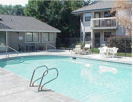 Woodbine Apartments in Boise, Idaho Pool with Lounge Chairs