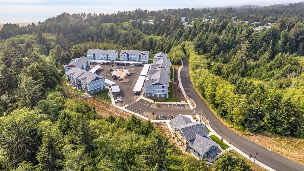 A large building complex surrounded by trees.