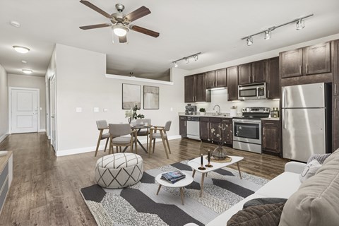 A modern kitchen with a dining table and chairs.