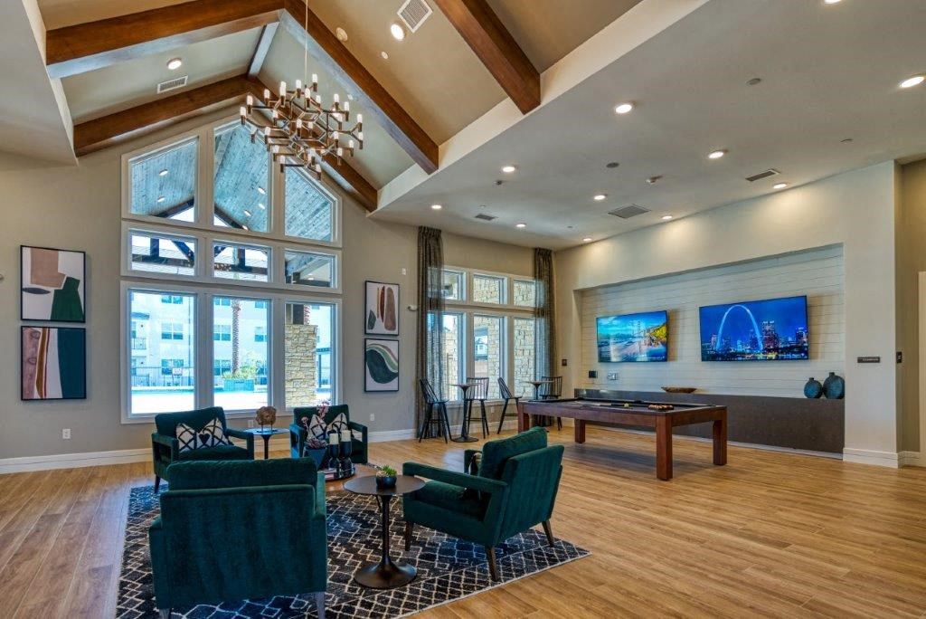 a game room with a pool table and a large window