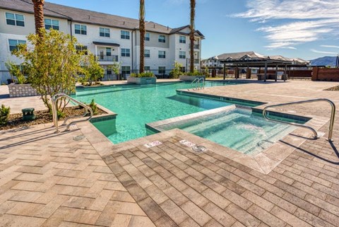 a swimming pool with a building in the background
