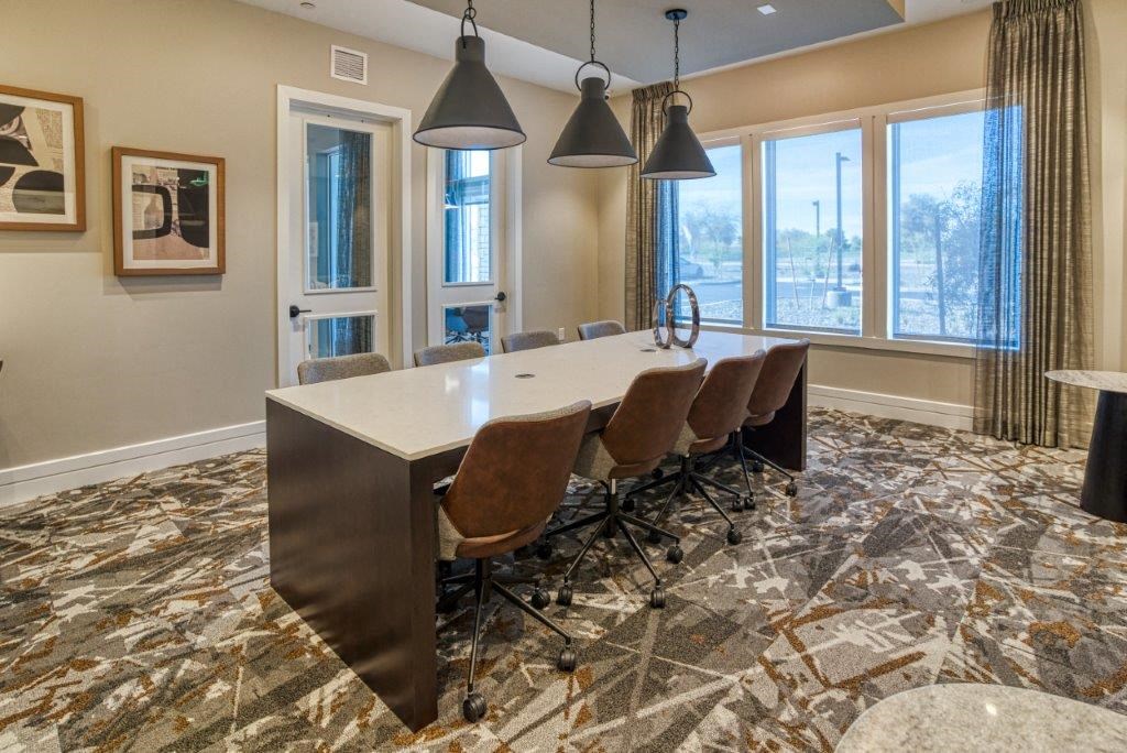 a conference room with a long table and chairs