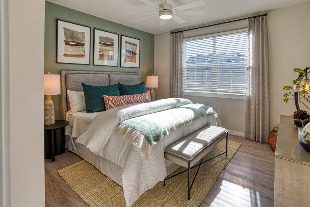 a bedroom with a bed and a window