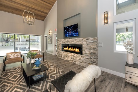 the residence living room with fireplace and tv