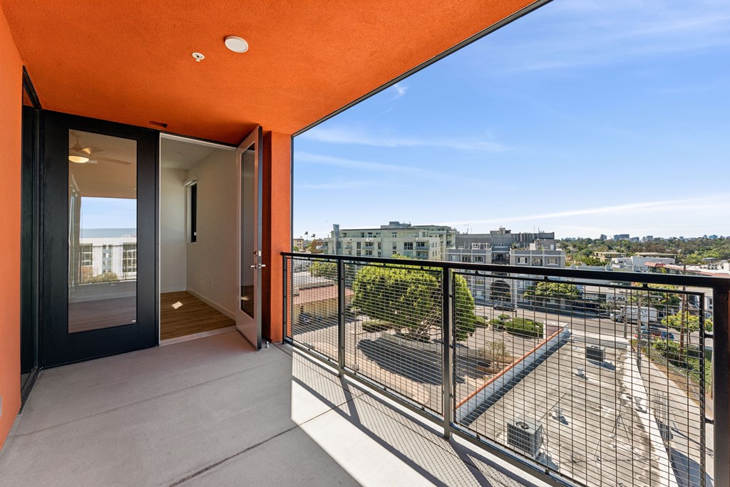 A balcony with a view of the cityscape.