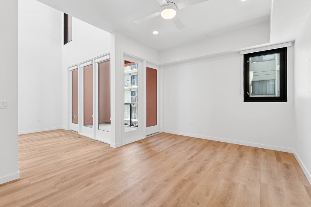 OnyxOnPark_SanDiego_CA_Vacant_Penthouse_A_A room with a wooden floor and a ceiling fan.