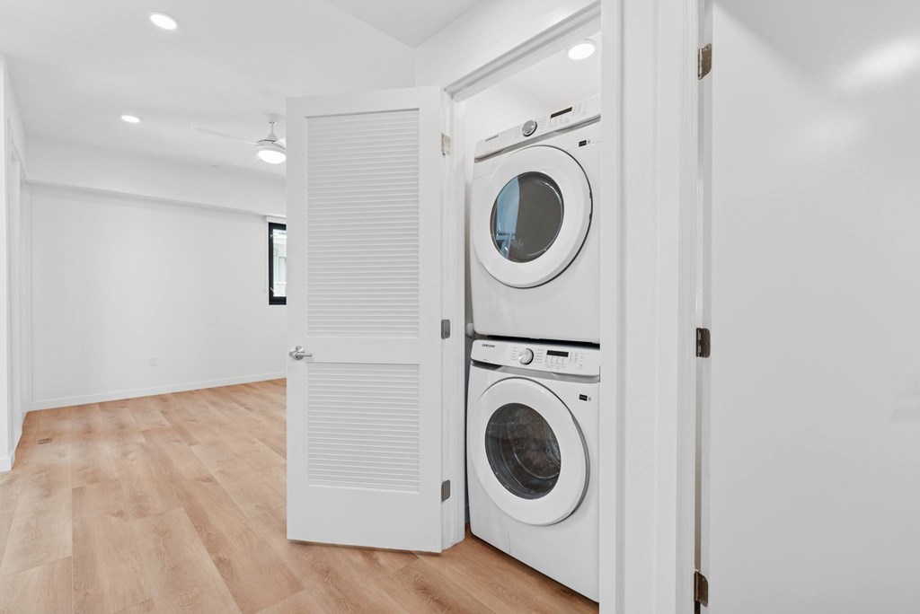 OnyxOnPark_SanDiego_CA_Vacant_Penthouse_A_A white laundry room with two washing machines.