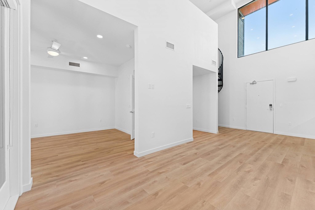OnyxOnPark_SanDiego_CA_Vacant_Penthouse_A_OnyxOnPark_SanDiego_CA_Vacant_Penthouse_A_A room with wooden floors and white walls.