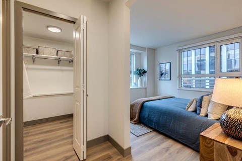 a bedroom with a bed and a closet