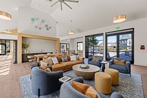 A modern living room with a grey sofa and a coffee table.