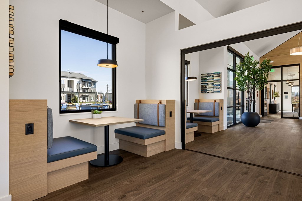 A modern waiting room with a view of the street outside.