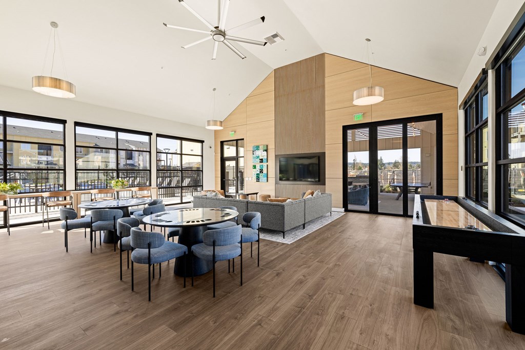 A modern room with a round table and chairs.