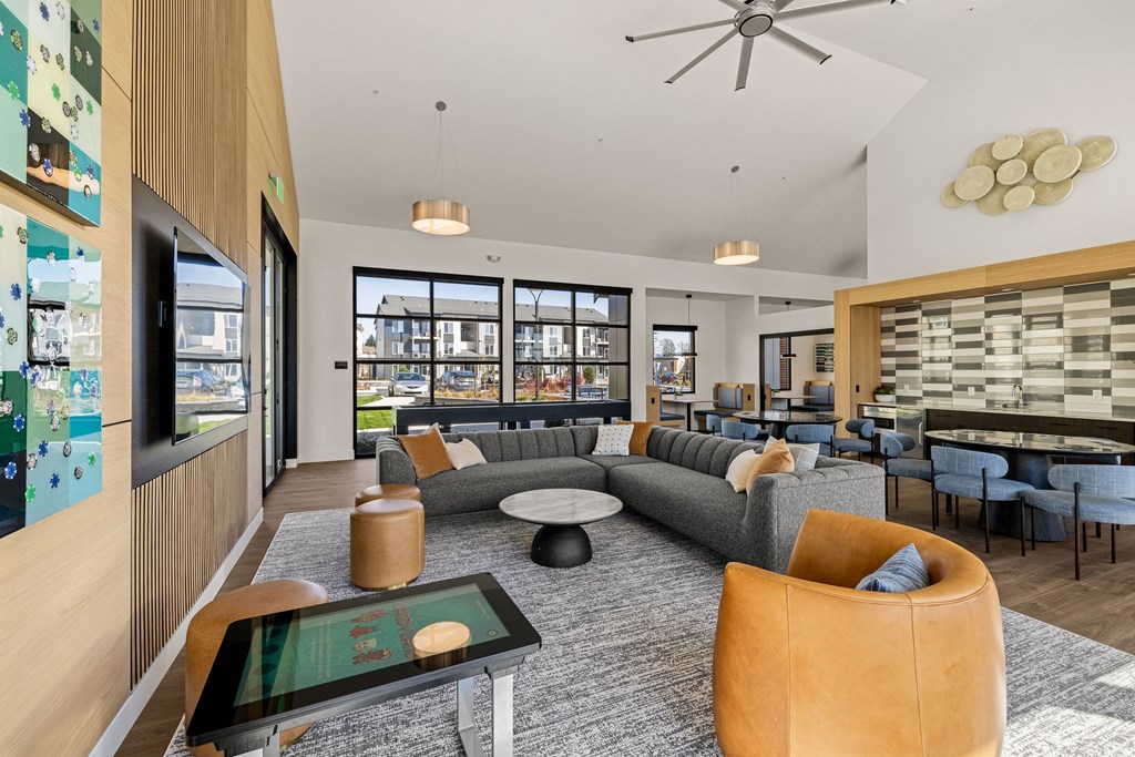 A modern living room with a grey sofa and a coffee table.