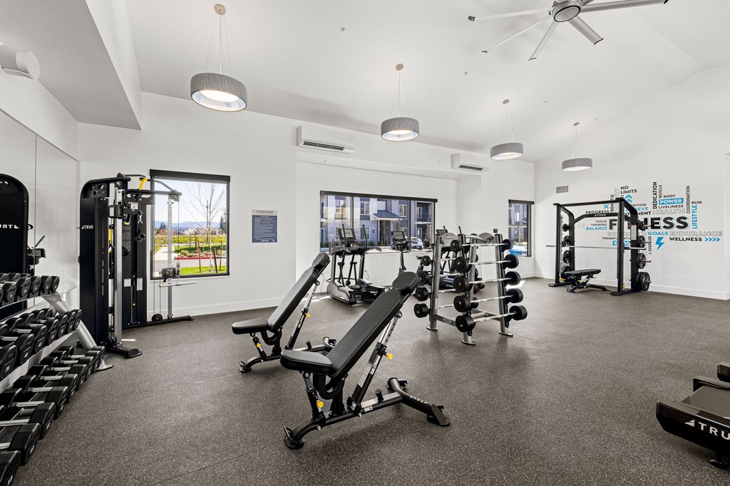 A gym with a variety of equipment including a TRUMPF machine.