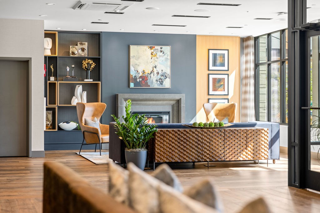 A living room with a fireplace, a sofa, and a chair.