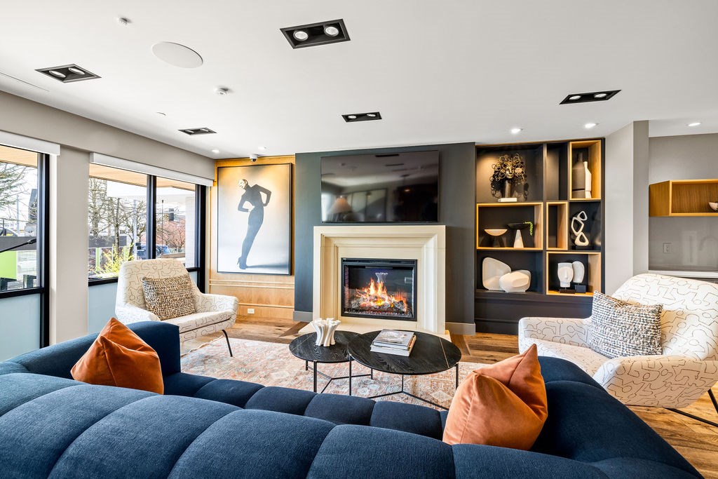 A modern living room with a fireplace and a large bed.