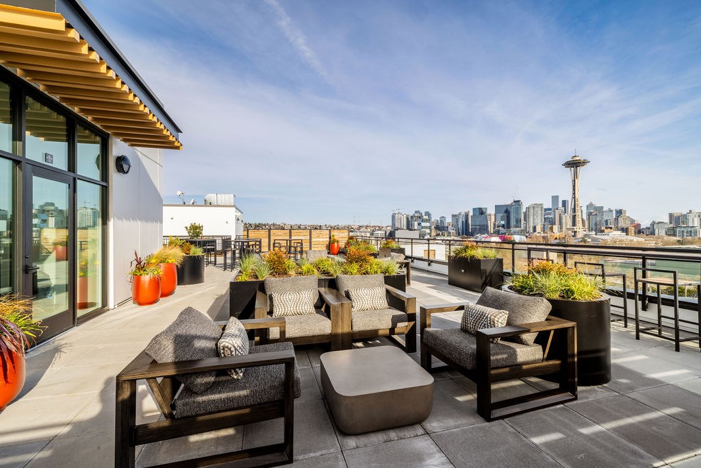 A patio with a view of the city skyline.