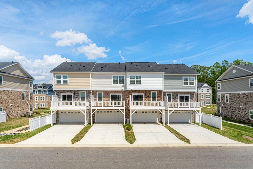 A large house with a garage in front of it.