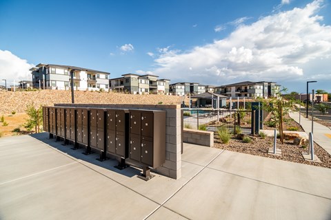 A modern building with a long row of lockers in front.
