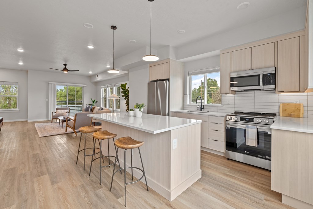 Alpine Landing Townhomes in Garden City, Idaho Model Kitchen with Large Island and Living Room Alpine Landing Townhomes in Garden City, Idaho Model Kitchen with Large Island and Living Room