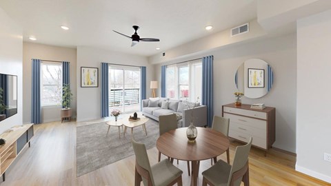 A modern living room with a dining table and chairs.