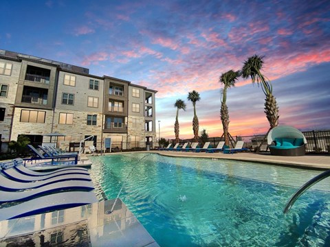 Cromwell at Plum Creek Apartments Pool Area and Lounge Chairs