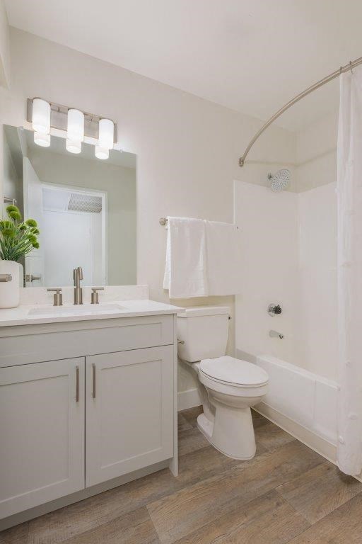 a bathroom with a toilet and a sink and a mirror
