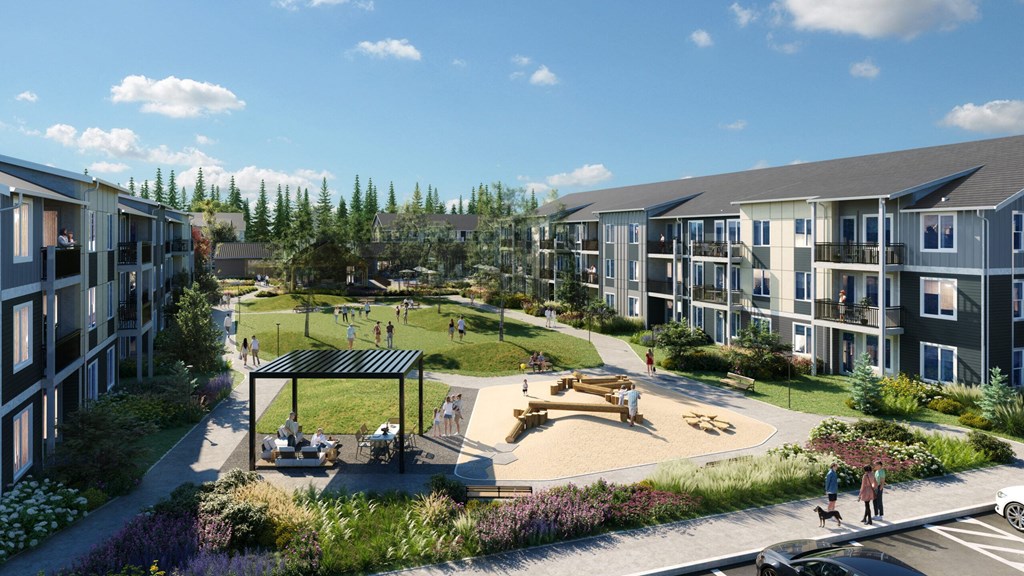A park area with a pavilion and people sitting on benches.