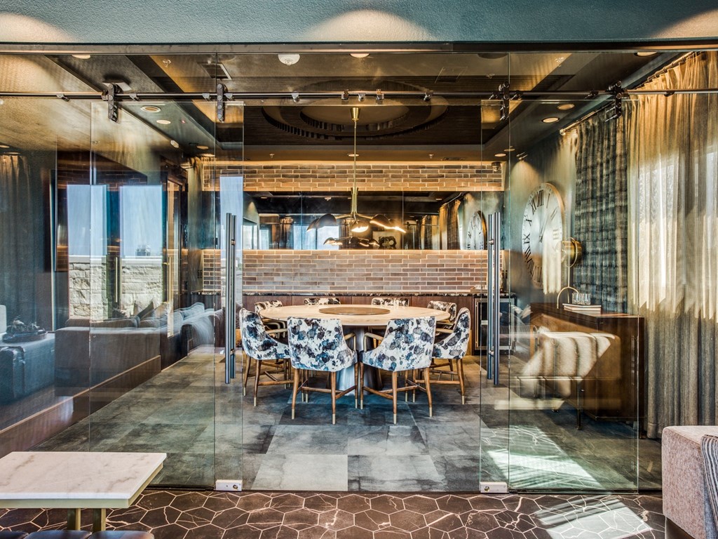 a dining room with a long table in the middle of it