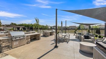 A patio area with tables and chairs is shown.