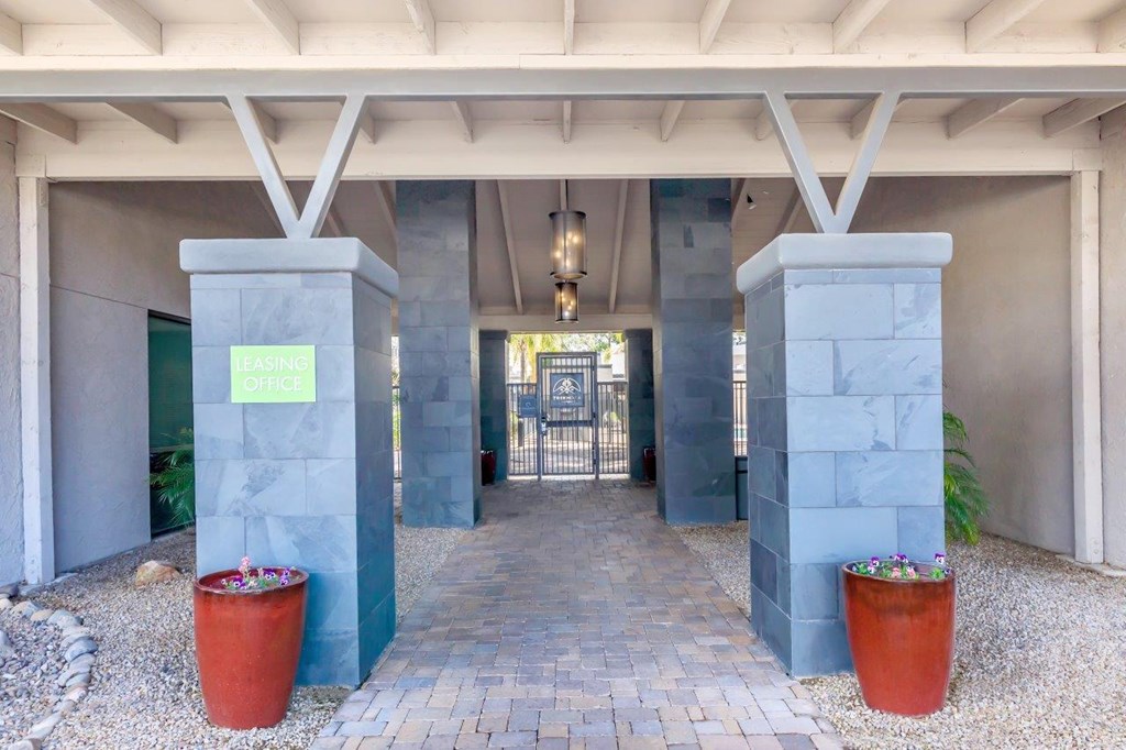 A stone pillar with the word "OFFICE" written on it.