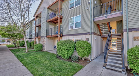Apartment building with a staircase leading to the second floor.