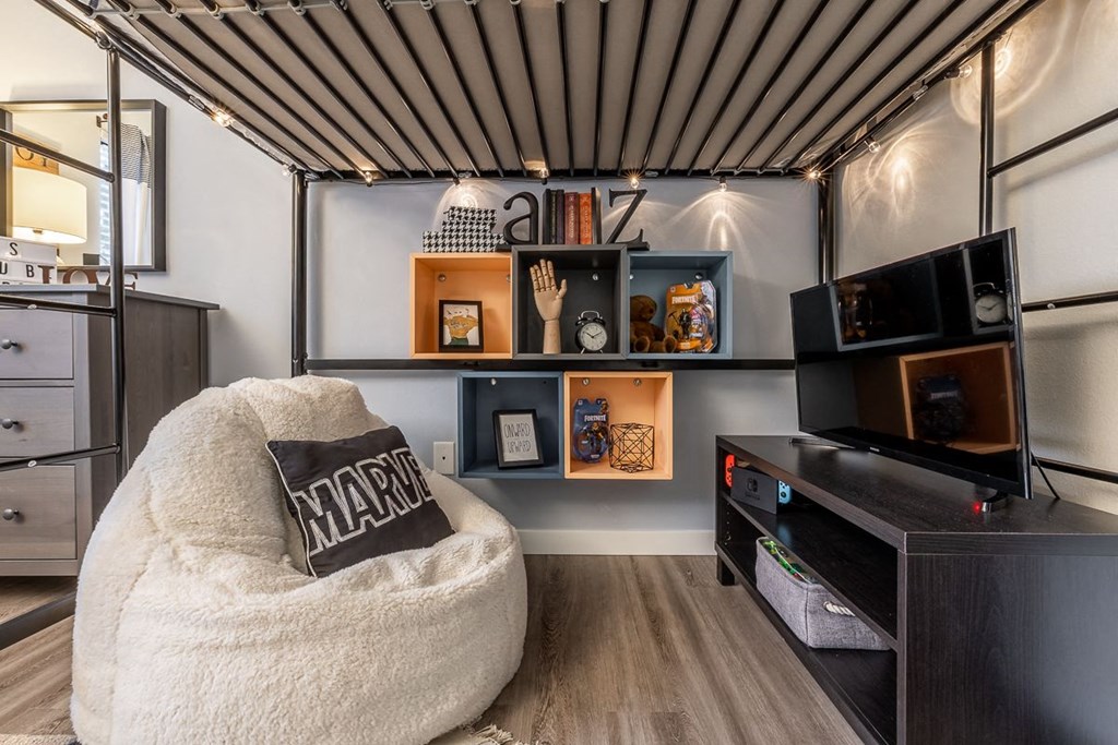 Park in Bellevue Apartments Model Guest Bedroom with Bean Bag Chair and TV