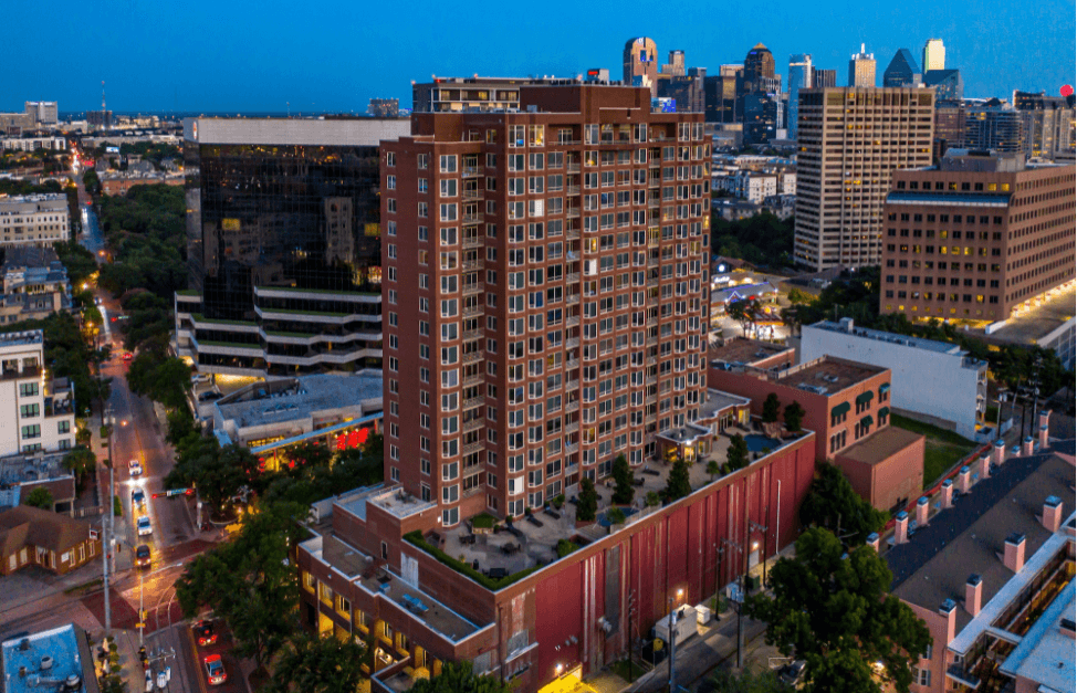 an aerial view of a building in a city at night