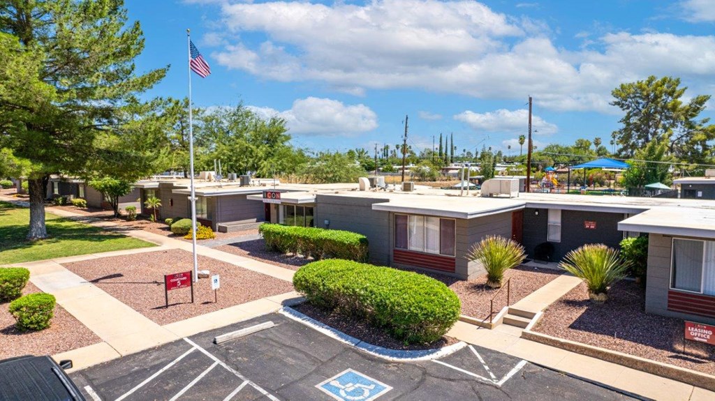 A parking lot with a handicap sign painted on the pavement.