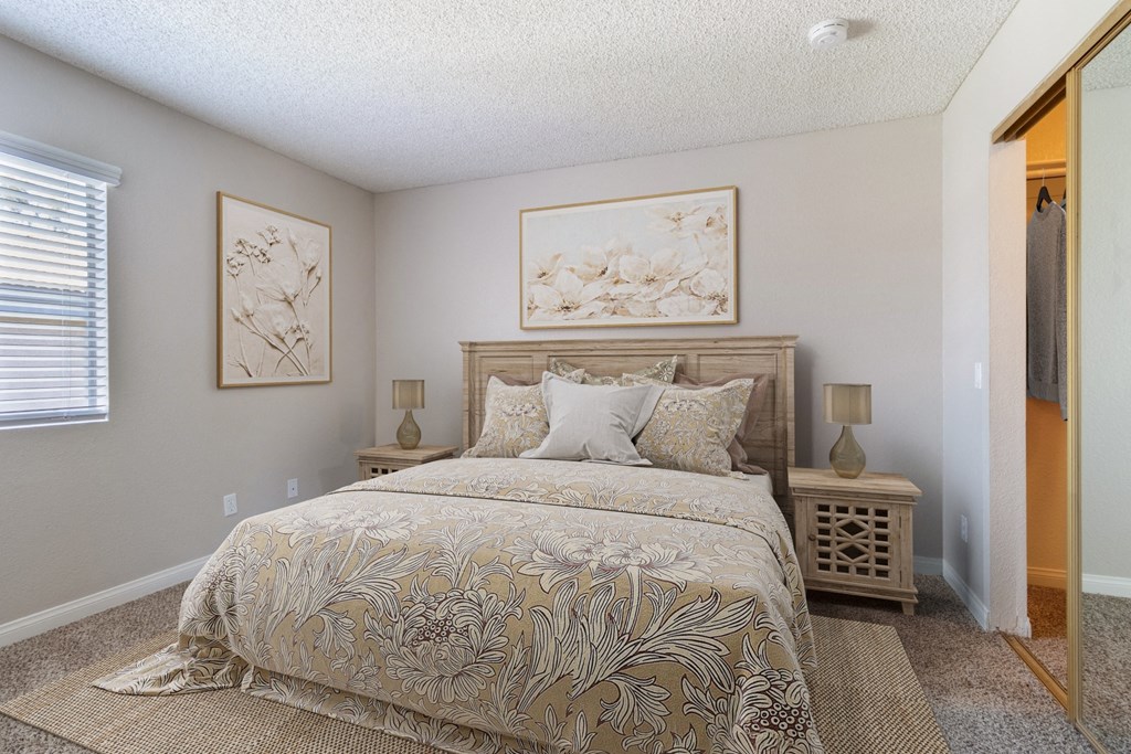 1-Bedroom Apartments in Murrieta, CA - Waterstone at Murrieta - Spacious Bedroom With Plush Carpeting, Closet With Sliding Mirror, And A Window