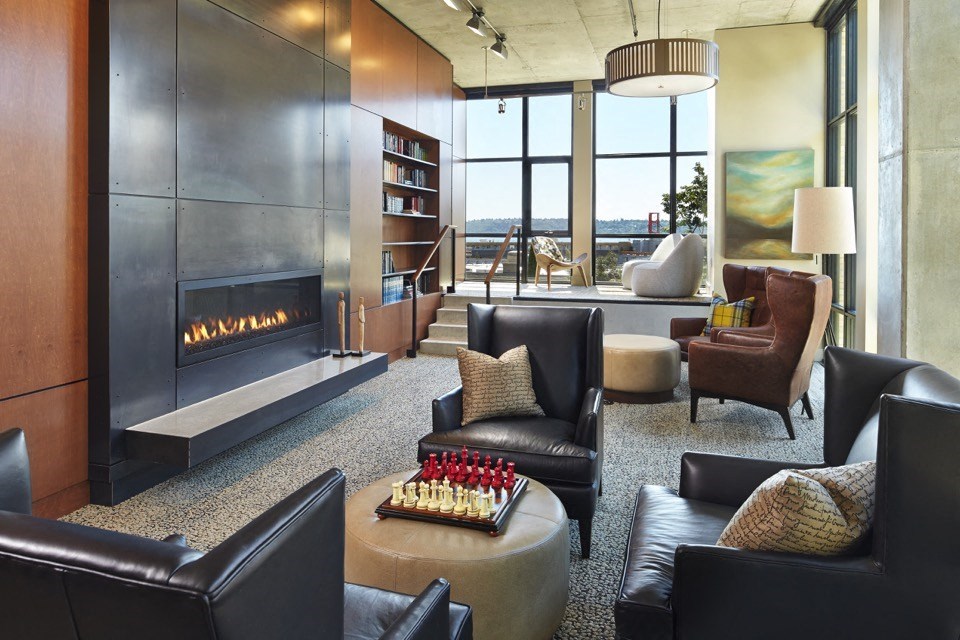 a living room filled with furniture and a fireplace