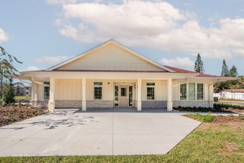 A building with a red roof and white walls.