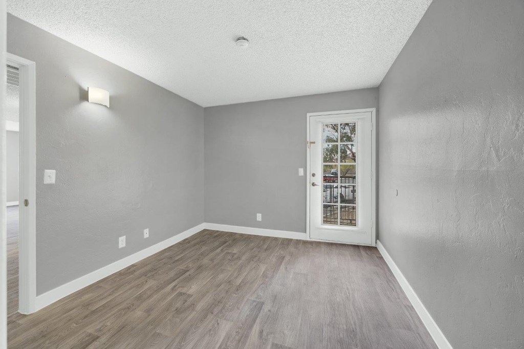 A room with a door and a window.