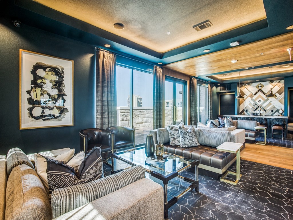 a living room filled with furniture and a large window