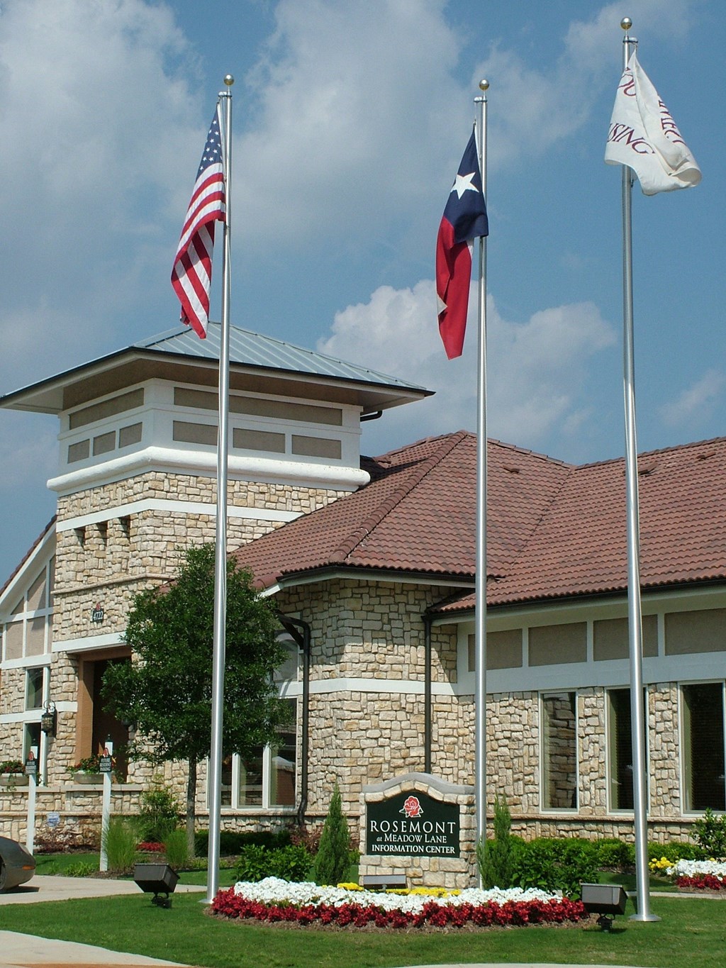 Rosemont at Meadow Lane Apartments Exterior Building and Flags