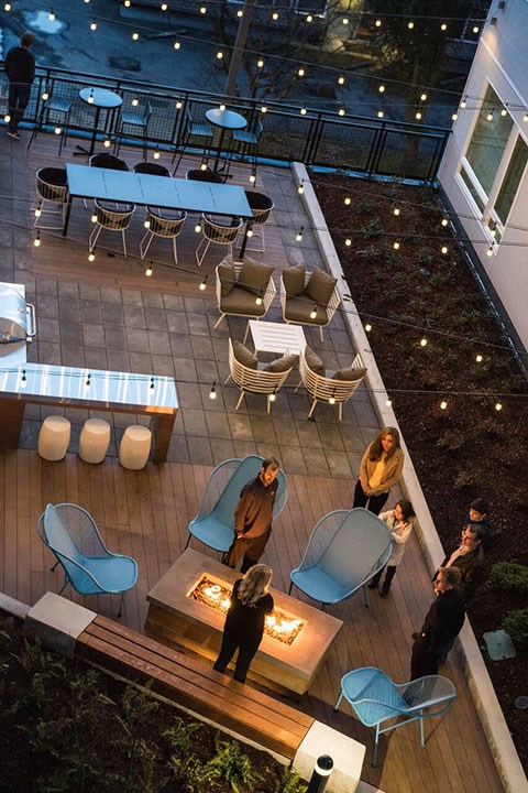an overhead view of a patio with tables and chairs