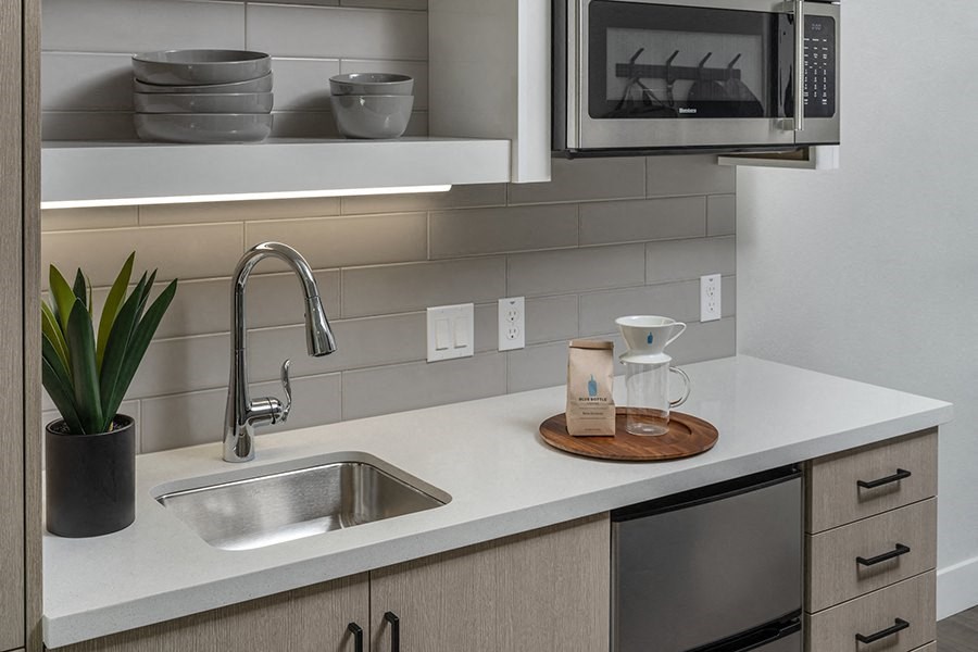a kitchen with a sink and a microwave