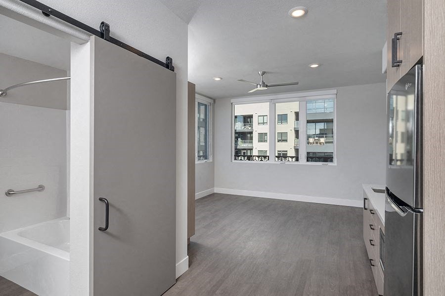 a bathroom with a shower stall and a bathtub