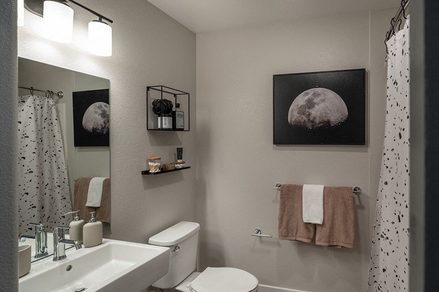 a small bathroom with a toilet sink and shower